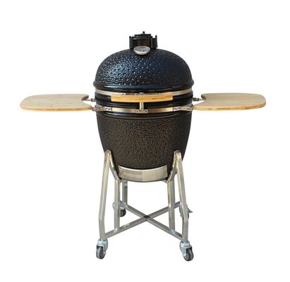 O carvão vegetal exterior alto nível da grade de um Kamado de 22 polegadas ateou fogo ao preto brilhante da resistência