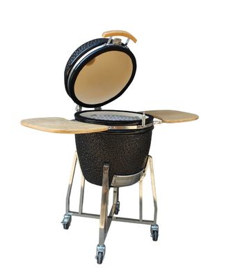O carvão vegetal exterior alto nível da grade de um Kamado de 22 polegadas ateou fogo ao preto brilhante da resistência